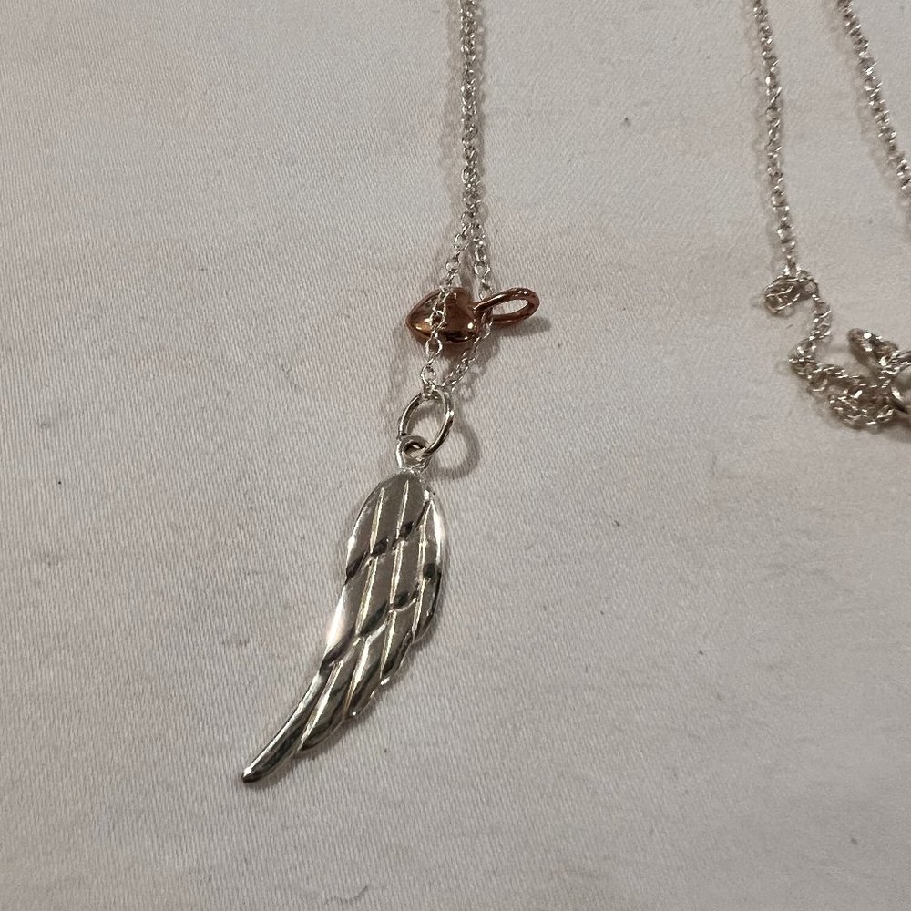 Silver feather and rose-gold heart necklace